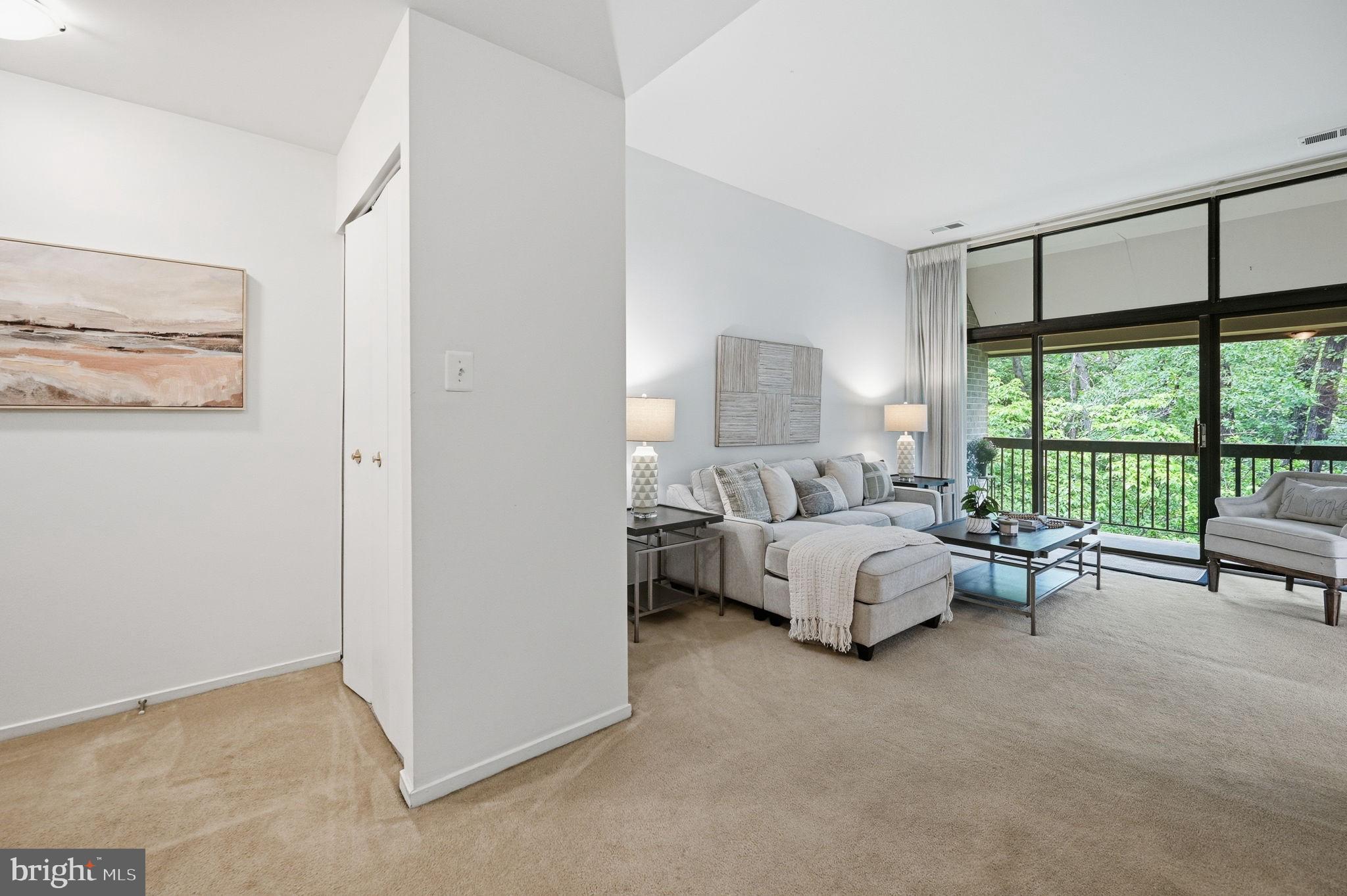 1659 Parkcrest Circle, Unit C Reston, VA 20190 - Photo 4 of 31 a bed room with a bed and a couch