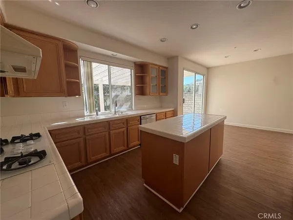a kitchen with a stove and a refrigerator