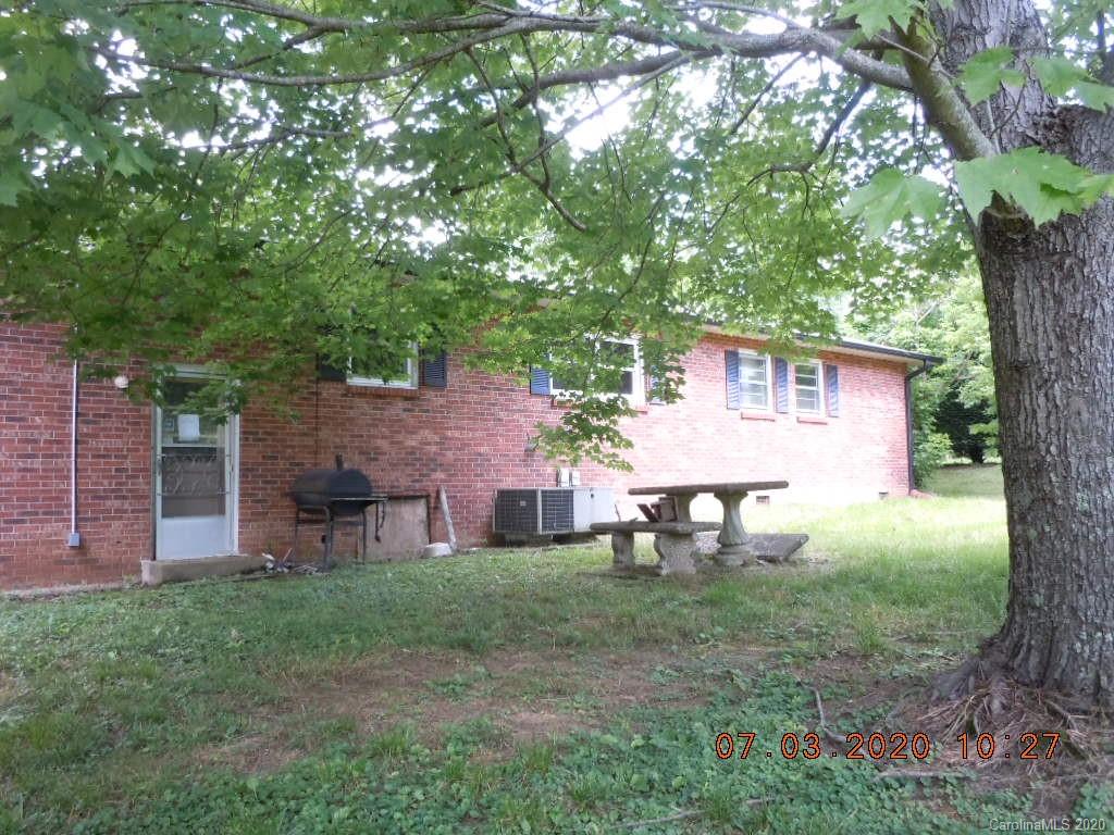 26 Thompson Cove Road Clyde, NC 28721 - Photo 4 of 16 a view of a house with a yard