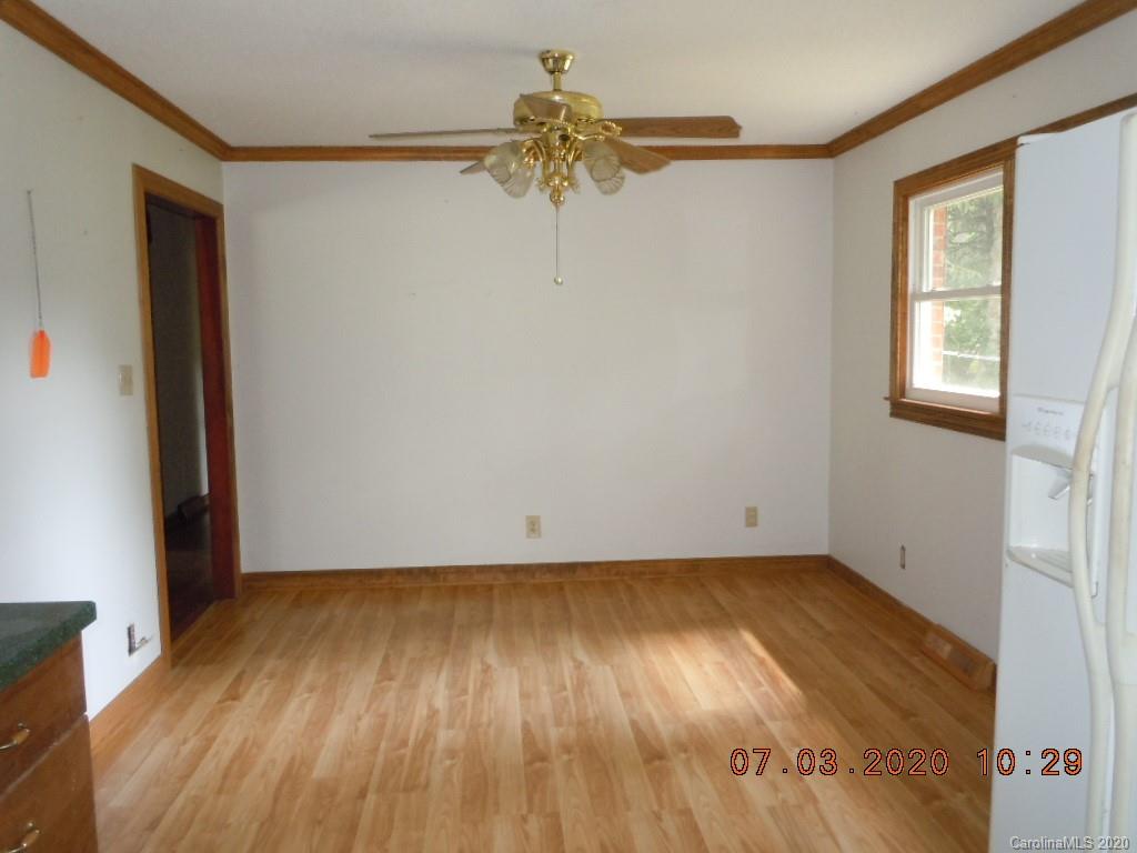 26 Thompson Cove Road Clyde, NC 28721 - Photo 10 of 16 a view of empty room with wooden floor and fan
