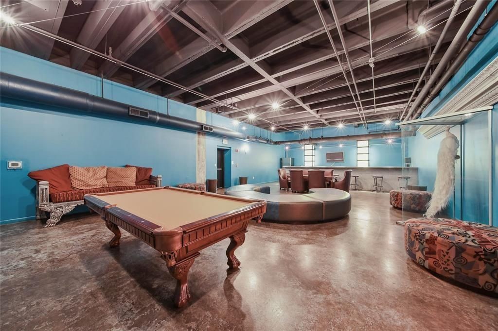 705 Main Street, Unit 610 Houston, TX 77002 - Photo 2 of 15 a living room with furniture and a flat screen tv