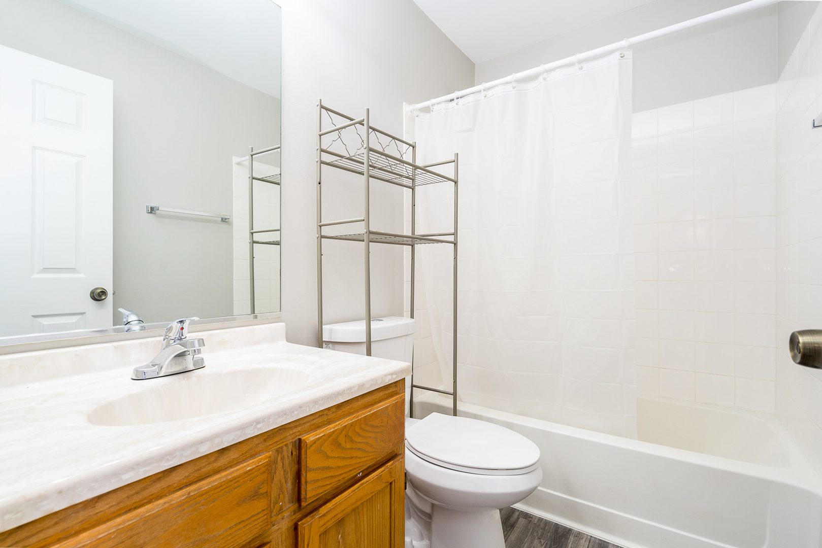 8191 Ripple Ridge Darien, IL 60561 - Photo 16 of 20 a bathroom with a sink and a mirror