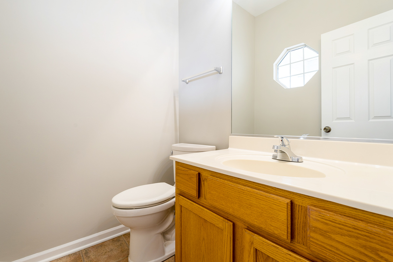 8191 Ripple Ridge Darien, IL 60561 - Photo 19 of 20 a bathroom with a sink a toilet and mirror