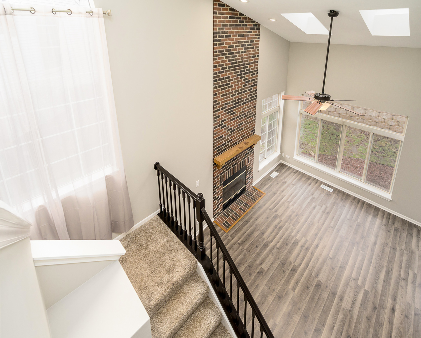 8191 Ripple Ridge Darien, IL 60561 - Photo 9 of 20 a view of a hallway with wooden floor and a bathroom
