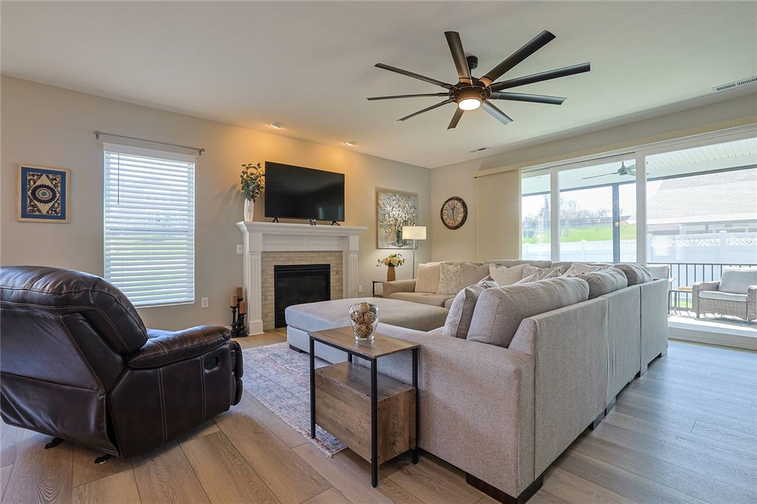 5013 Arena Court Hamilton, OH 45011 - Photo 6 of 41 This inviting space features comfortable seating and a warm fireplace, perfect for relaxation and gatherings.