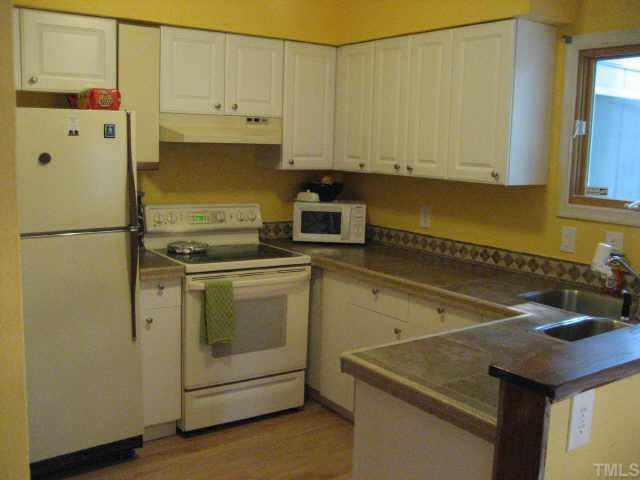 4316 Lake Ridge Drive Raleigh, NC 27604 - Photo 4 of 10 Updated kitchen with tile countertops, mosiac back splash new white cabinets, refridgerator,washer and dryer convey Other