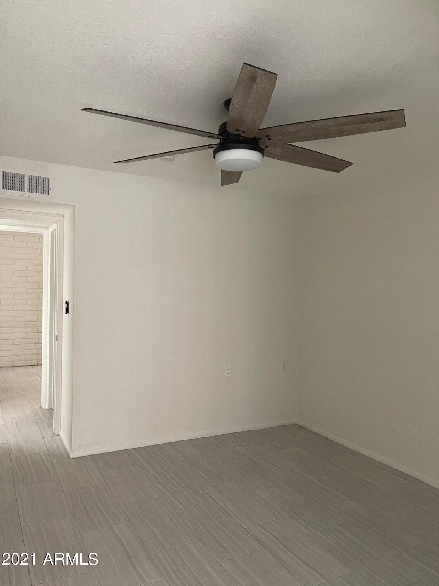 12847 North 113th Avenue, Unit 14 Youngtown, AZ 85363 - Photo 4 of 10 a view of small space with racks on the wall