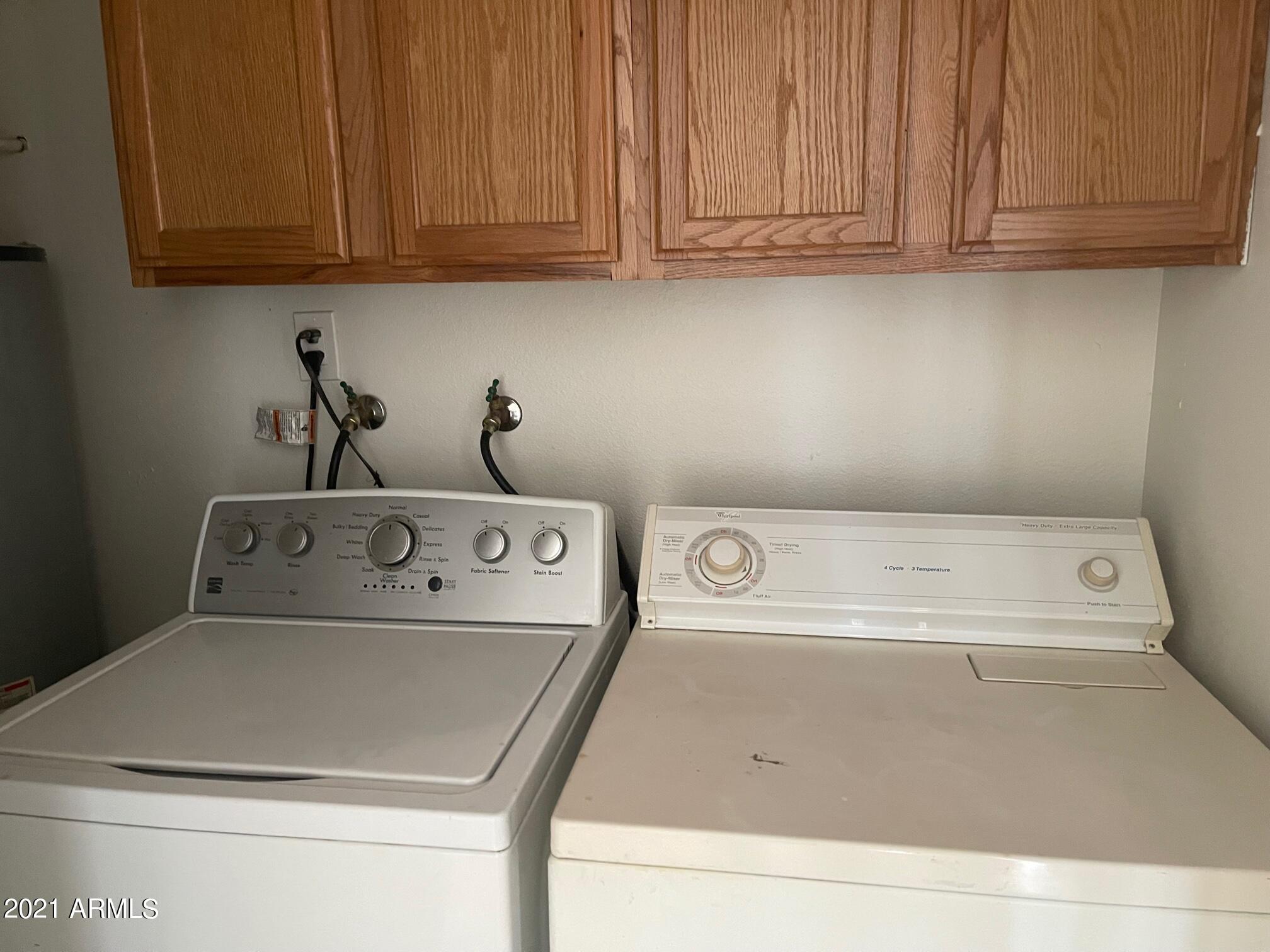 12847 North 113th Avenue, Unit 14 Youngtown, AZ 85363 - Photo 7 of 10 a utility room with dryer and washer