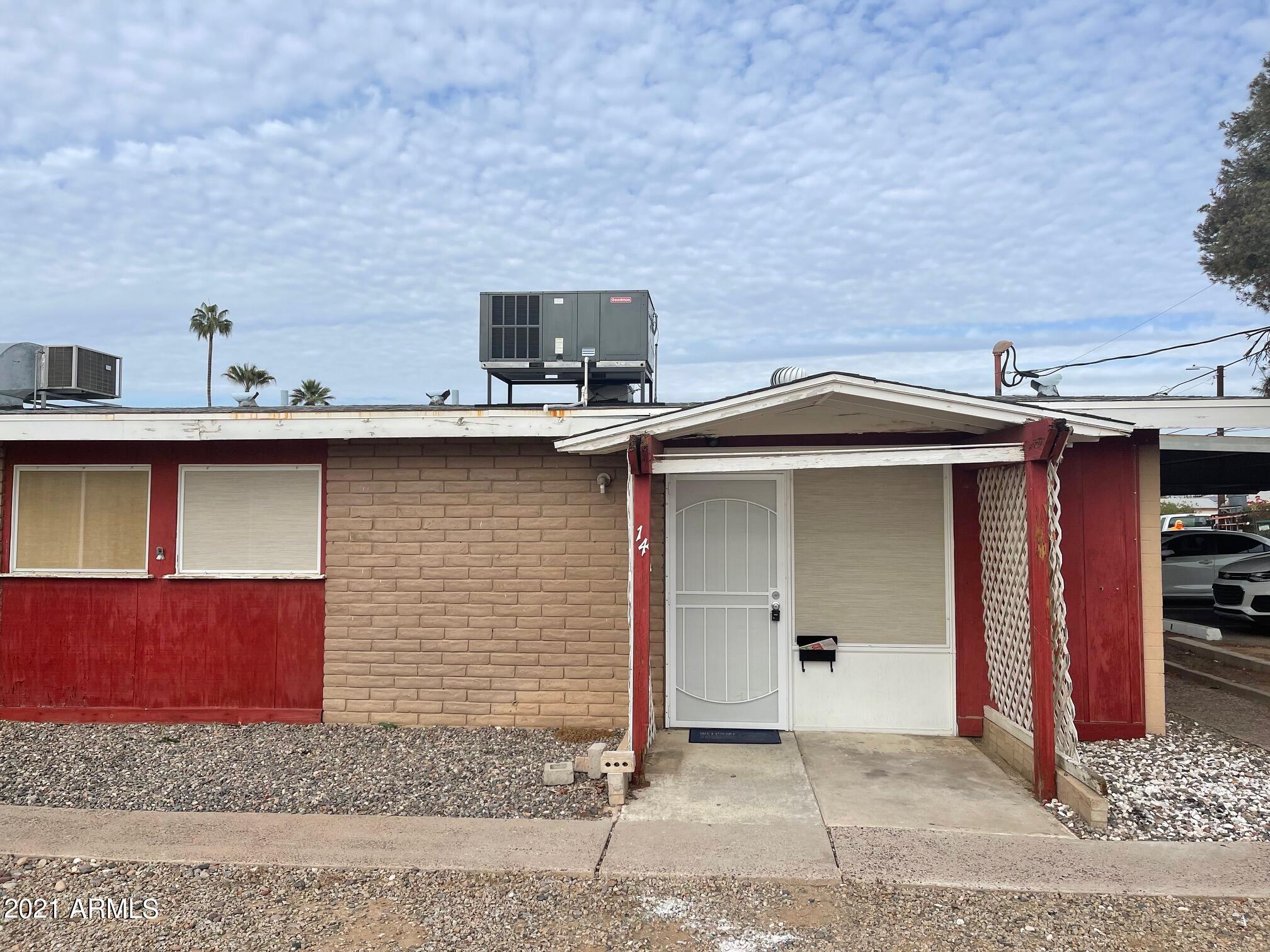 12847 North 113th Avenue, Unit 14 Youngtown, AZ 85363 - Photo 8 of 10 a view of a house with garage