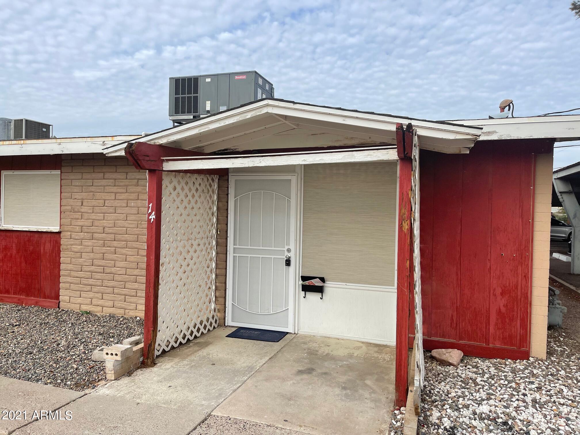 12847 North 113th Avenue, Unit 14 Youngtown, AZ 85363 - Photo 9 of 10 a front view of a house