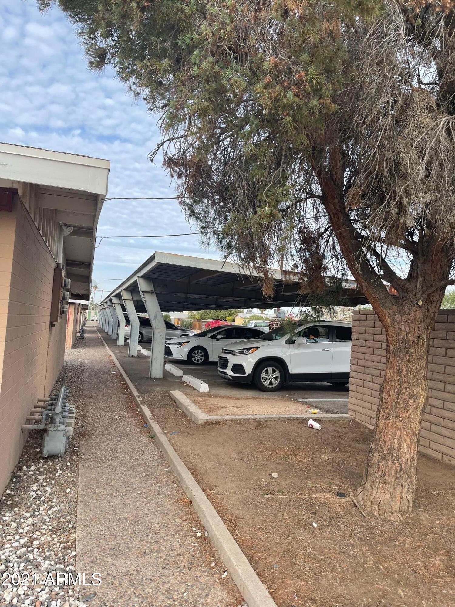 12847 North 113th Avenue, Unit 14 Youngtown, AZ 85363 - Photo 10 of 10 a view of a car in front of a house