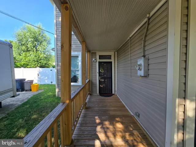 a view of a balcony with wooden floor