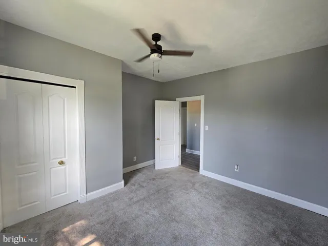 a view of a garden with a building in the background