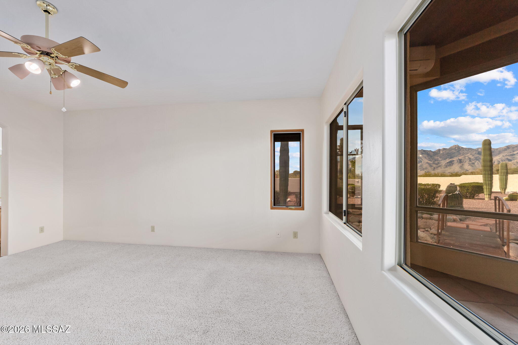 3655 North Harrison Road Tucson, AZ 85749 - Photo 24 of 51 an empty room with windows and city view