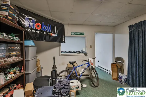 a view of a storage & utility room with sink dryer and washer