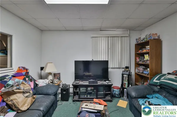a bed room with a bed and a chair