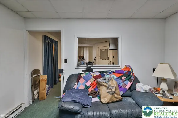 a living room with furniture and flat screen tv