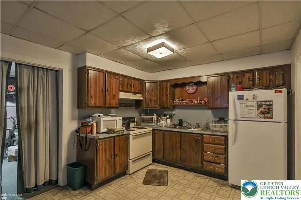 a room with furniture and a potted plant