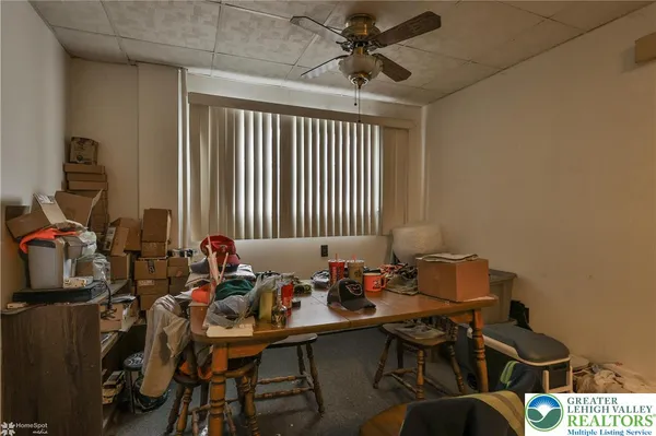 a living room with lots of furniture and a flat screen tv