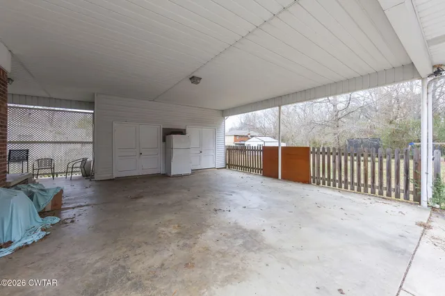 a view of livingroom with furniture and windows