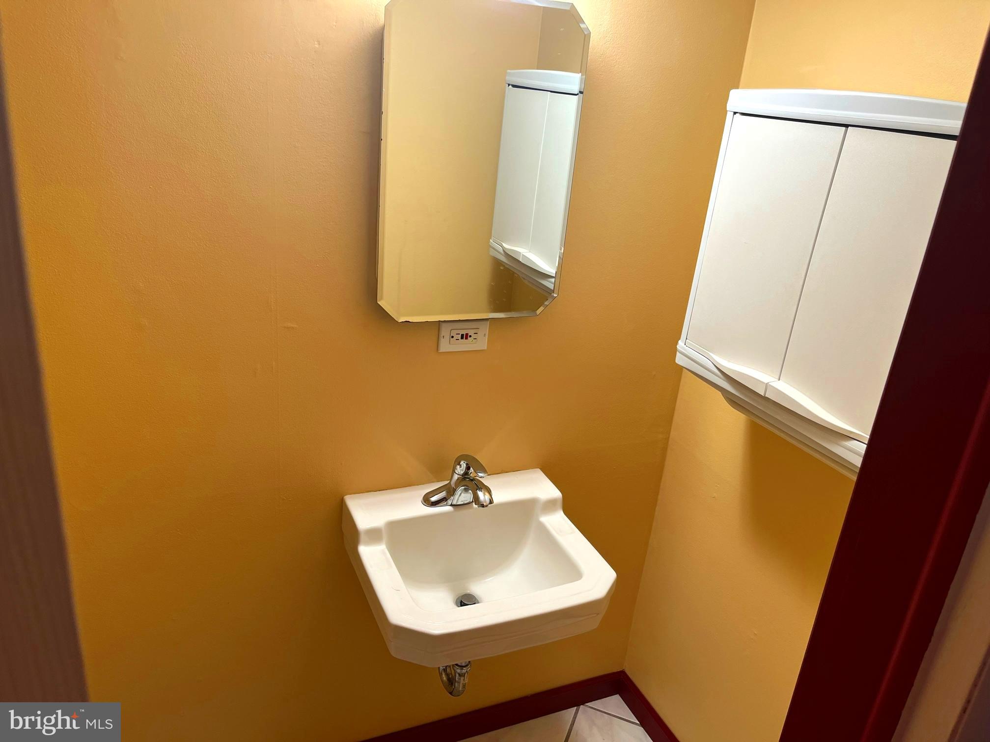 117 Knox Boulevard Marlton, NJ 08053 - Photo 18 of 21 a bathroom with a sink and a mirror