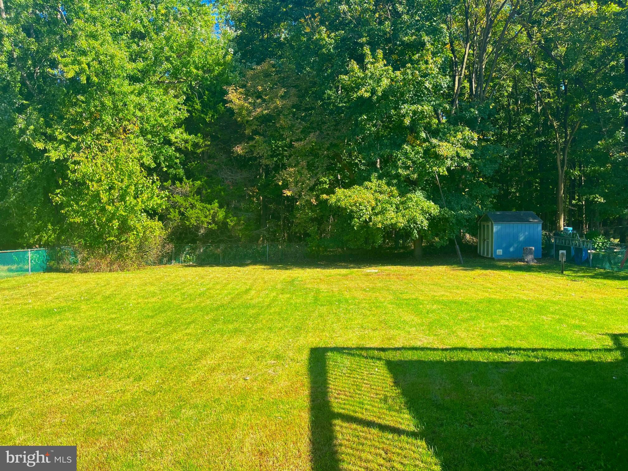 117 Knox Boulevard Marlton, NJ 08053 - Photo 19 of 21 a view of a large pool with lawn chairs under an umbrella