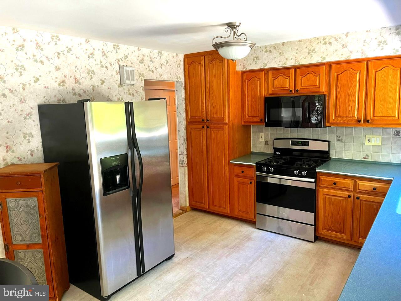 117 Knox Boulevard Marlton, NJ 08053 - Photo 5 of 21 a kitchen with stainless steel appliances granite countertop a refrigerator a stove and a sink
