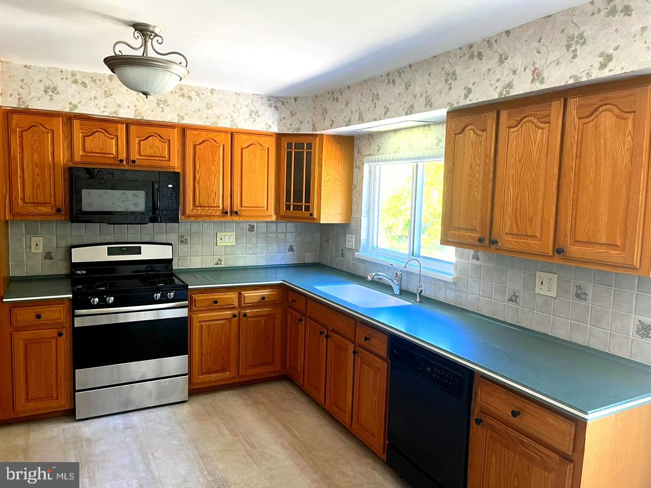 117 Knox Boulevard Marlton, NJ 08053 - Photo 6 of 21 a kitchen with stainless steel appliances granite countertop a sink stove and microwave