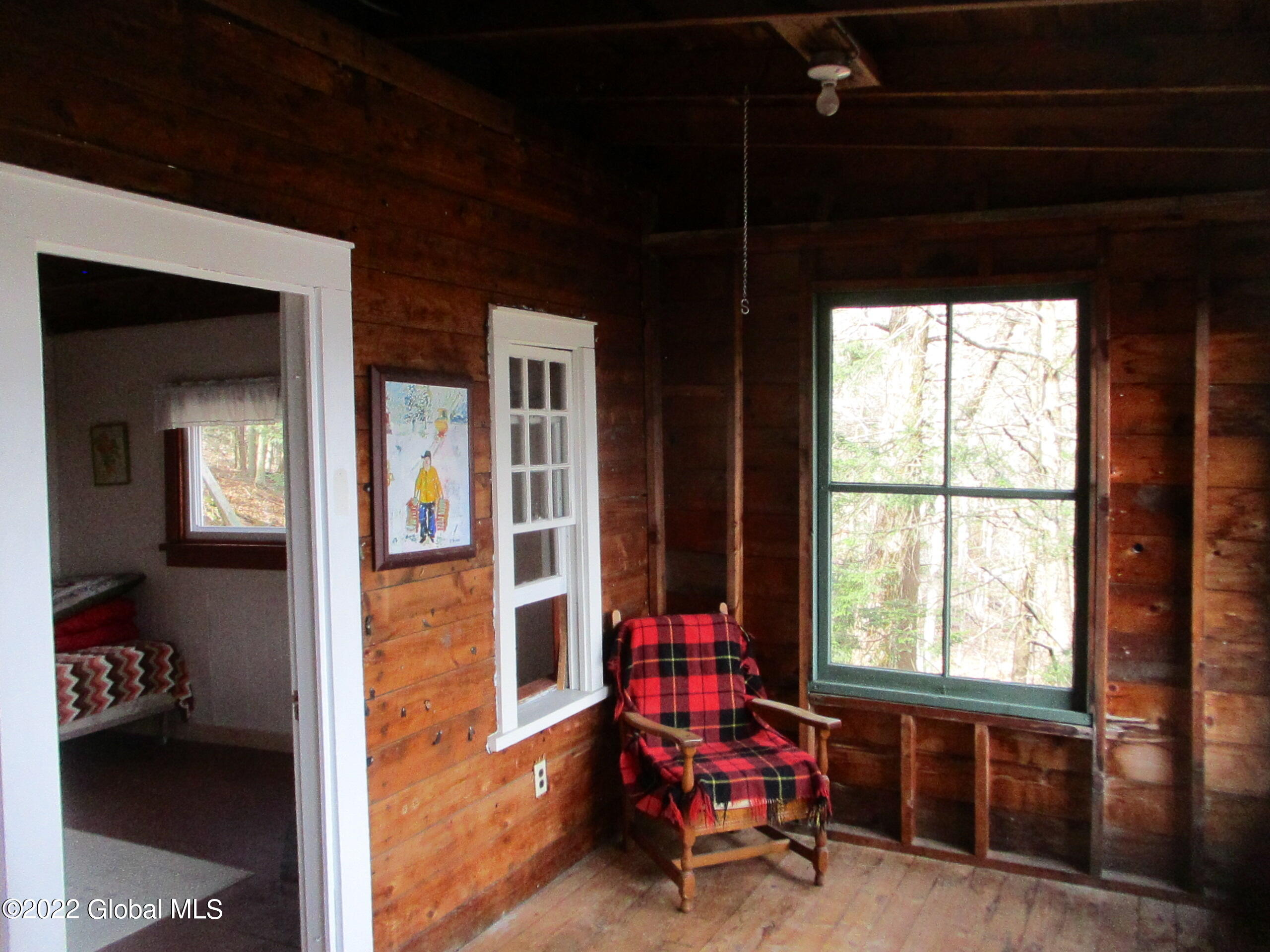 719 Lake Desolation Road Providence, NY 12850 - Photo 29 of 51 27 Enclosed Porch, Doorway into Living R