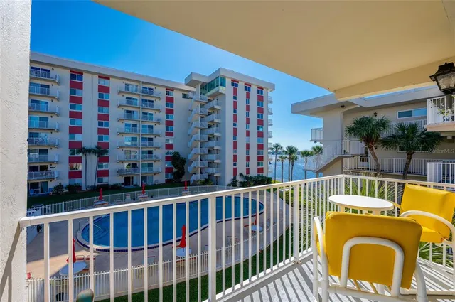 a view of building with yard and entertaining space