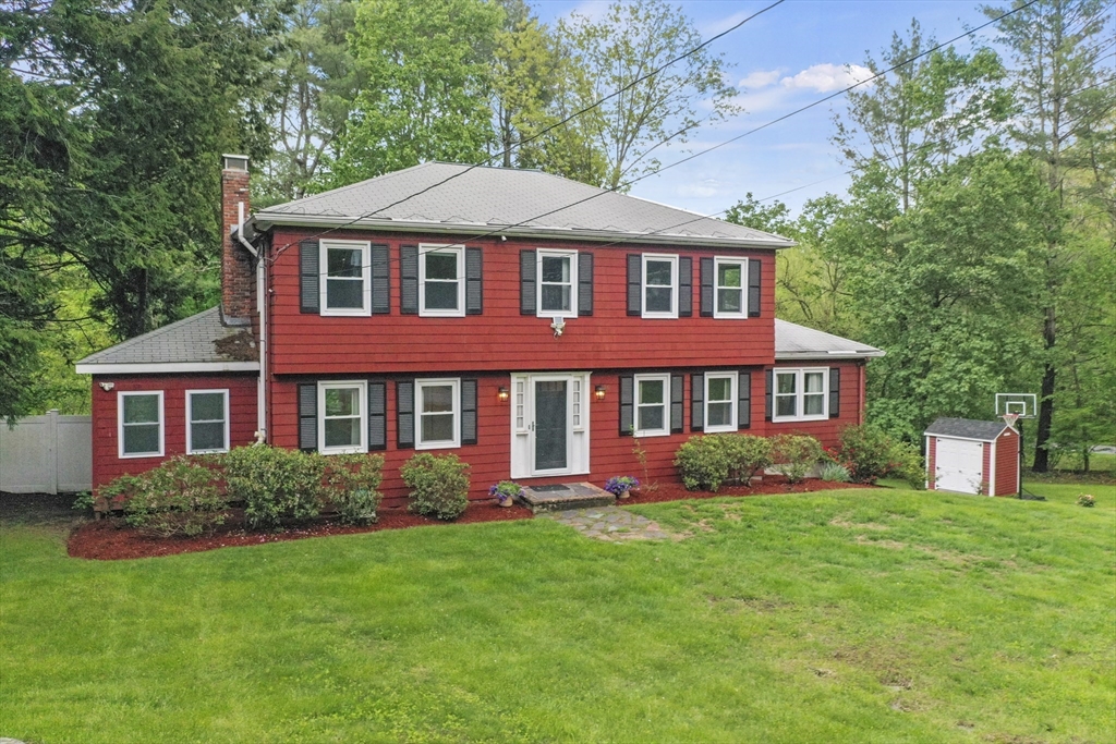 36 Duggan Road Acton, MA 01720 - Photo 1 of 40 a front view of a house with garden