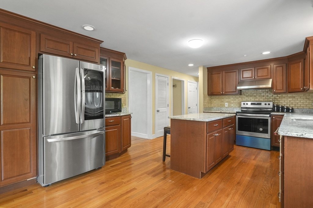 36 Duggan Road Acton, MA 01720 - Photo 13 of 40 a kitchen with stainless steel appliances granite countertop a refrigerator stove and oven