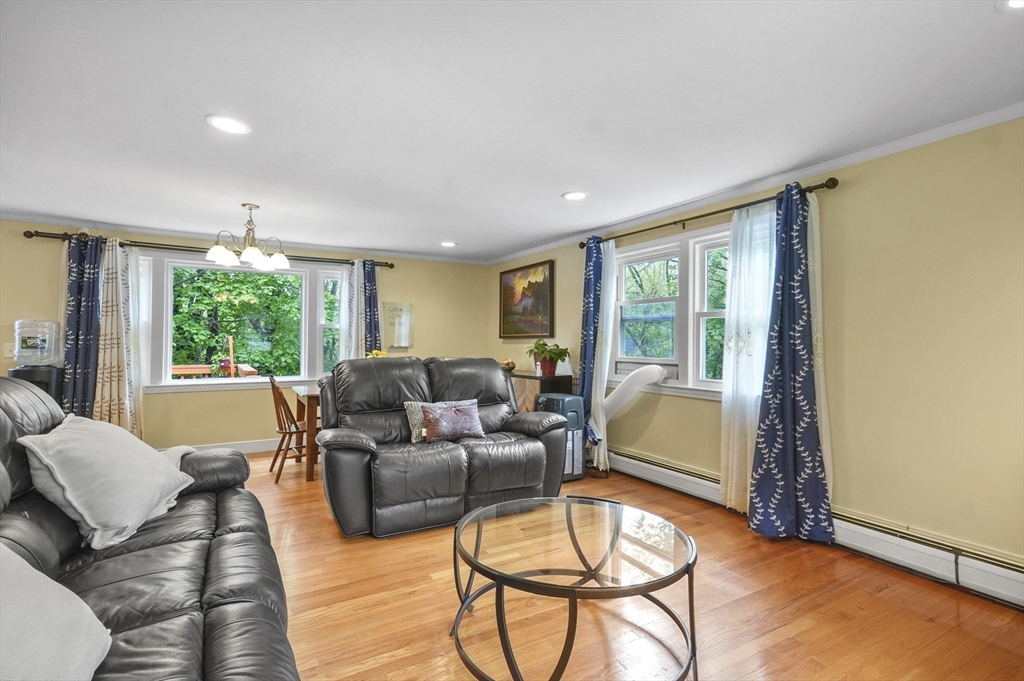 36 Duggan Road Acton, MA 01720 - Photo 16 of 40 a living room with furniture and a large window