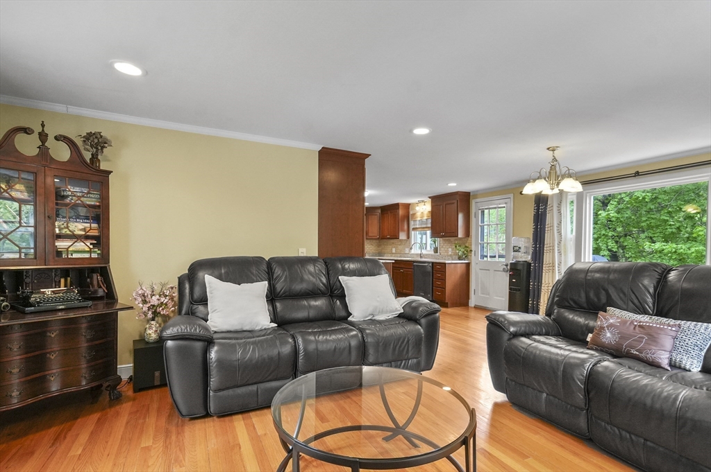 36 Duggan Road Acton, MA 01720 - Photo 17 of 40 a living room with furniture wooden floor and a large window