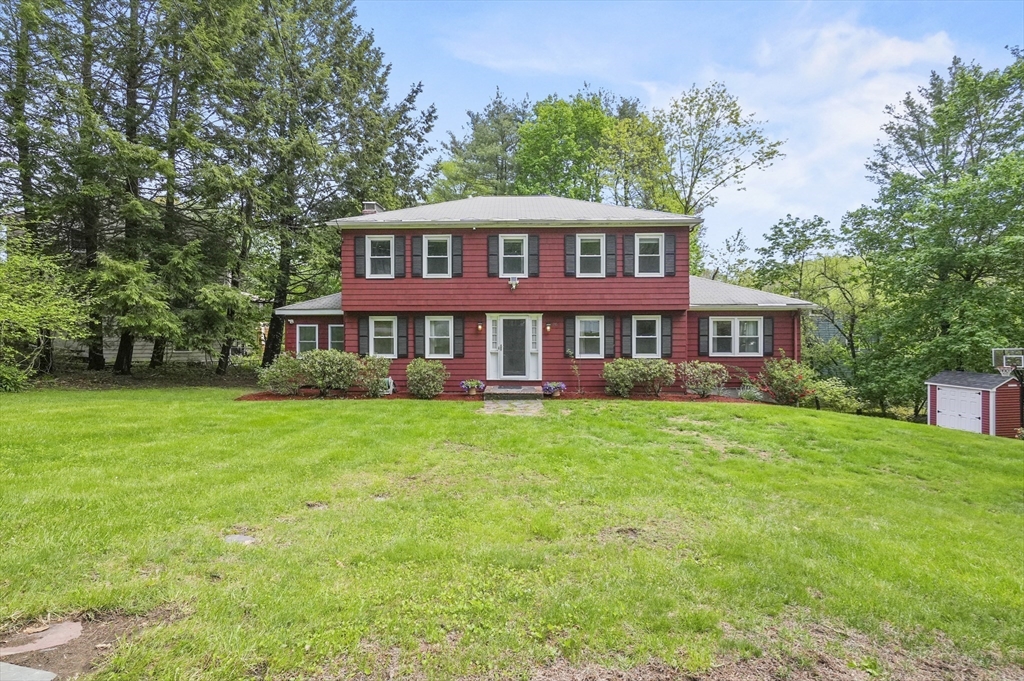 36 Duggan Road Acton, MA 01720 - Photo 2 of 40 a front view of a house with a garden
