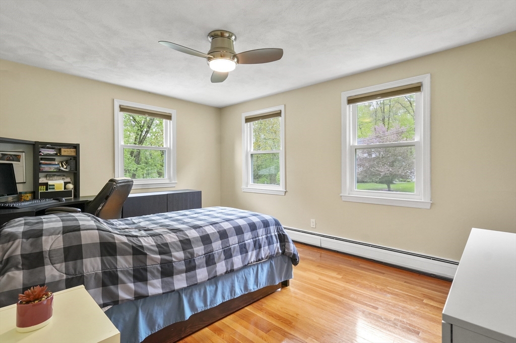 36 Duggan Road Acton, MA 01720 - Photo 22 of 40 a bedroom with a large bed and a window