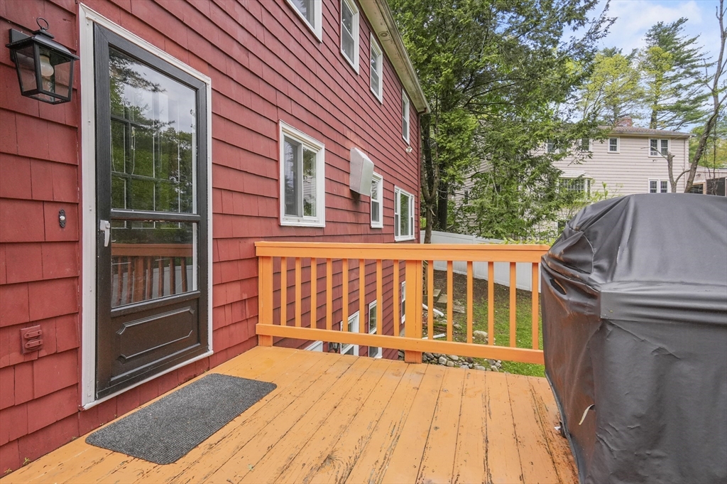 36 Duggan Road Acton, MA 01720 - Photo 32 of 40 a view of backyard with deck and outdoor seating