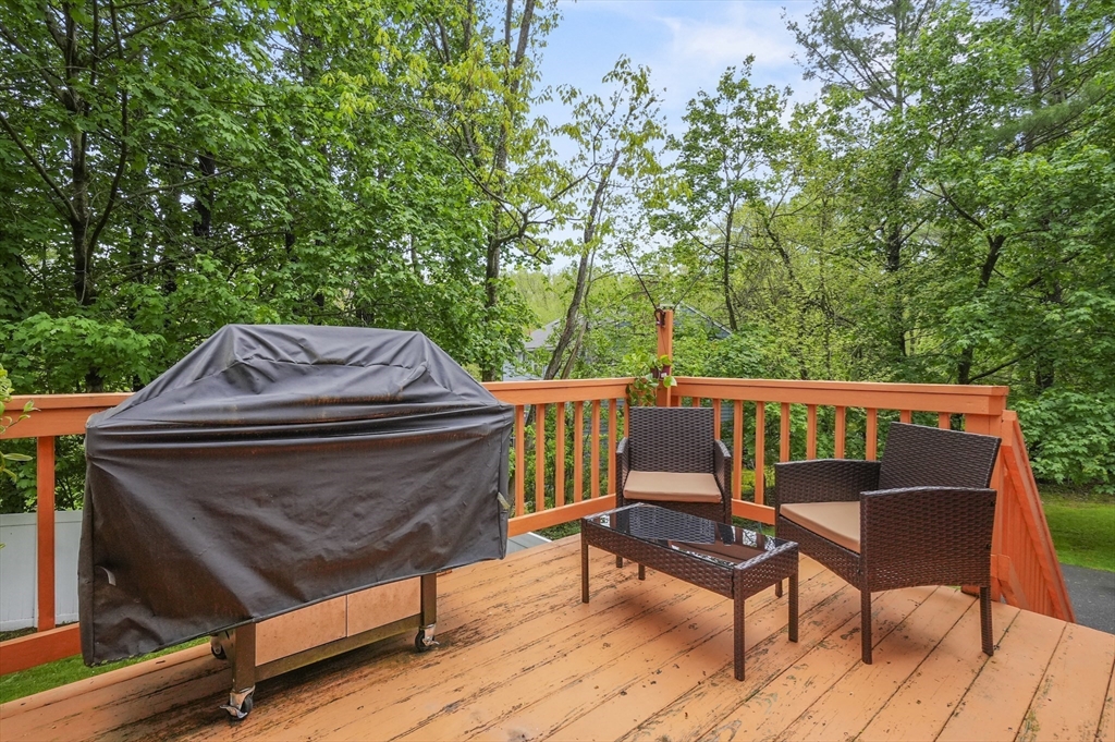 36 Duggan Road Acton, MA 01720 - Photo 33 of 40 a view of a chairs and table on the deck