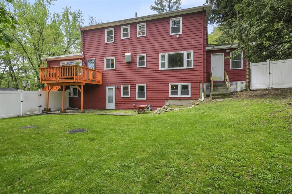 36 Duggan Road Acton, MA 01720 - Photo 34 of 40 a front view of a house with a yard