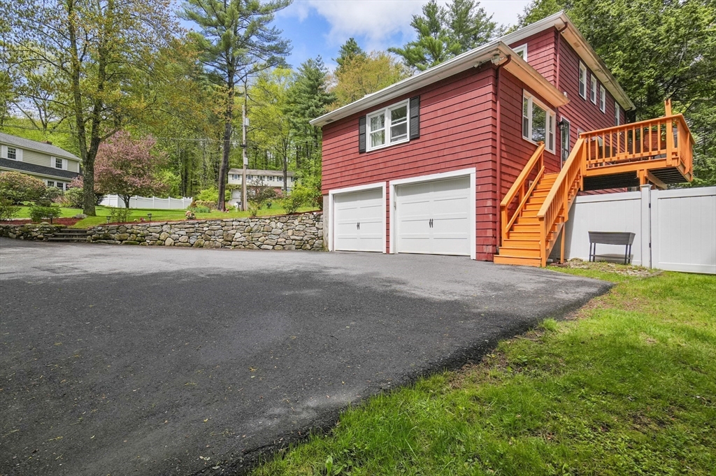 36 Duggan Road Acton, MA 01720 - Photo 36 of 40 a view of a house with a yard and a house