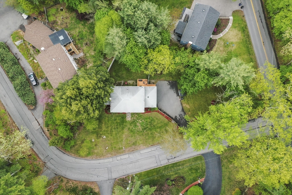 36 Duggan Road Acton, MA 01720 - Photo 39 of 40 an aerial view of a house with garden space and trees