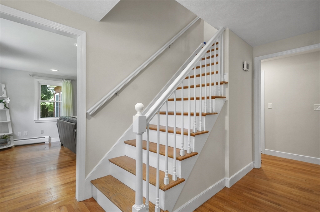 36 Duggan Road Acton, MA 01720 - Photo 4 of 40 a view of staircase with wooden floor and staircase