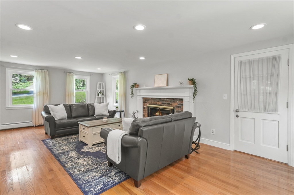 36 Duggan Road Acton, MA 01720 - Photo 5 of 40 a living room with furniture and a fireplace