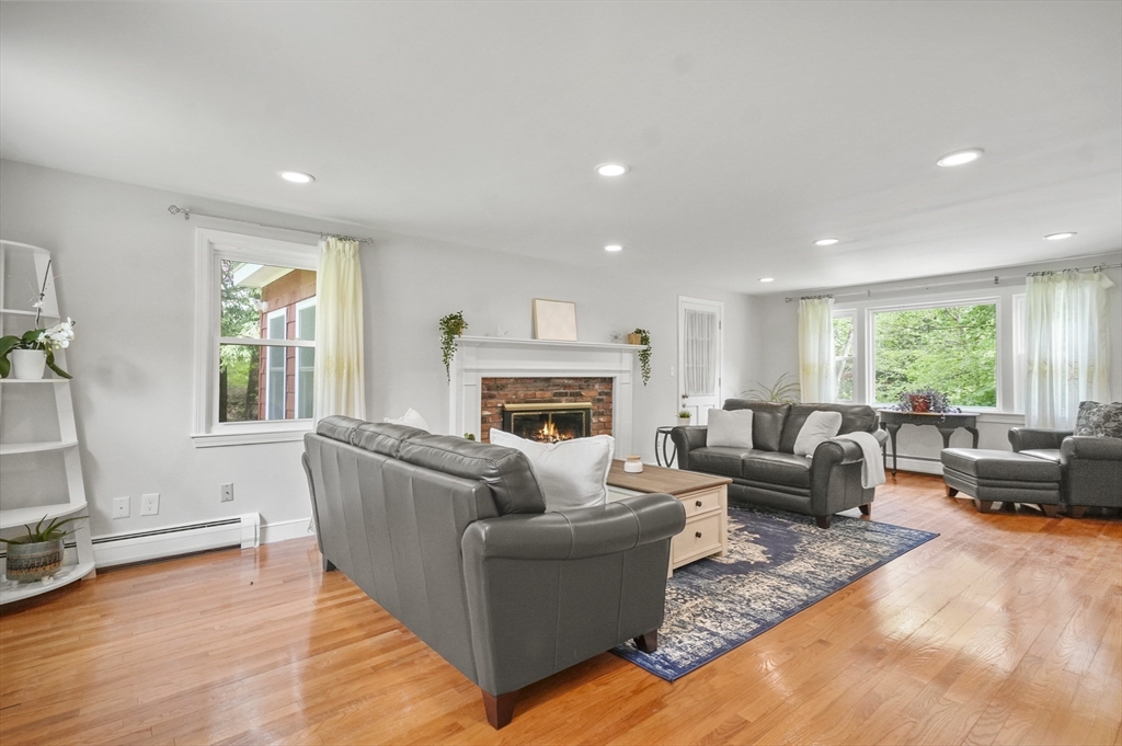 36 Duggan Road Acton, MA 01720 - Photo 6 of 40 a living room with furniture window and a fireplace