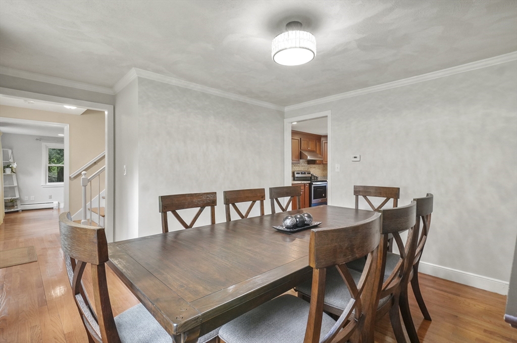 36 Duggan Road Acton, MA 01720 - Photo 8 of 40 a view of a dining room with furniture and wooden floor