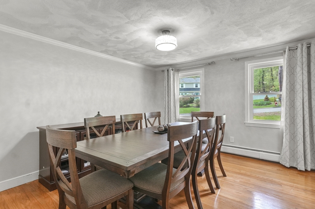 36 Duggan Road Acton, MA 01720 - Photo 9 of 40 a view of a dining room with furniture and wooden floor