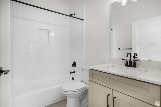 1631 West Century Lane, Unit C Mapleton, UT 84664 - Photo 14 of 31 Bathroom featuring a white tub/shower combination with an integrated niche, a single-sink vanity with light-toned cabinetry, a light-colored countertop, and matte black fixtures throughout