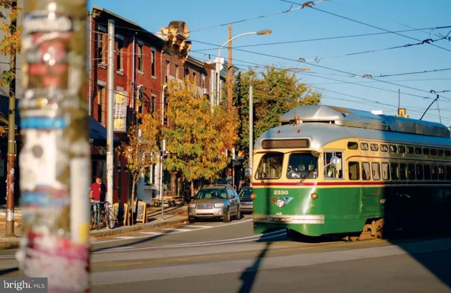 a group of people sitting in a yard