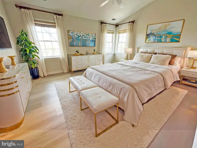 a bedroom with a large bed and a couch