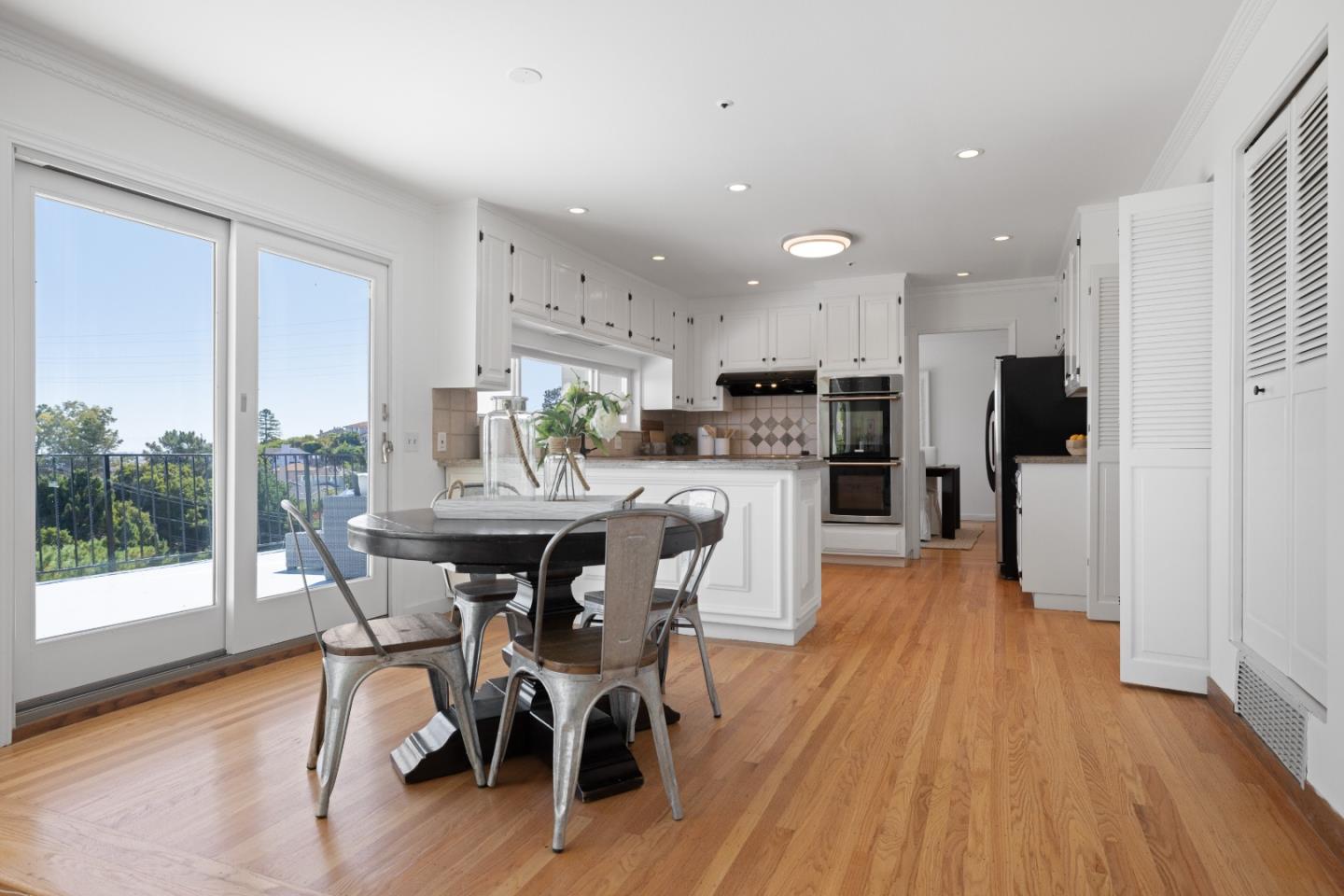 866 Morningside Drive Millbrae, CA 94030 - Photo 12 of 57 a view of a dining room with furniture and wooden floor